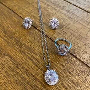 Silver necklace with matching earrings and ring size 7. Stainless Steel